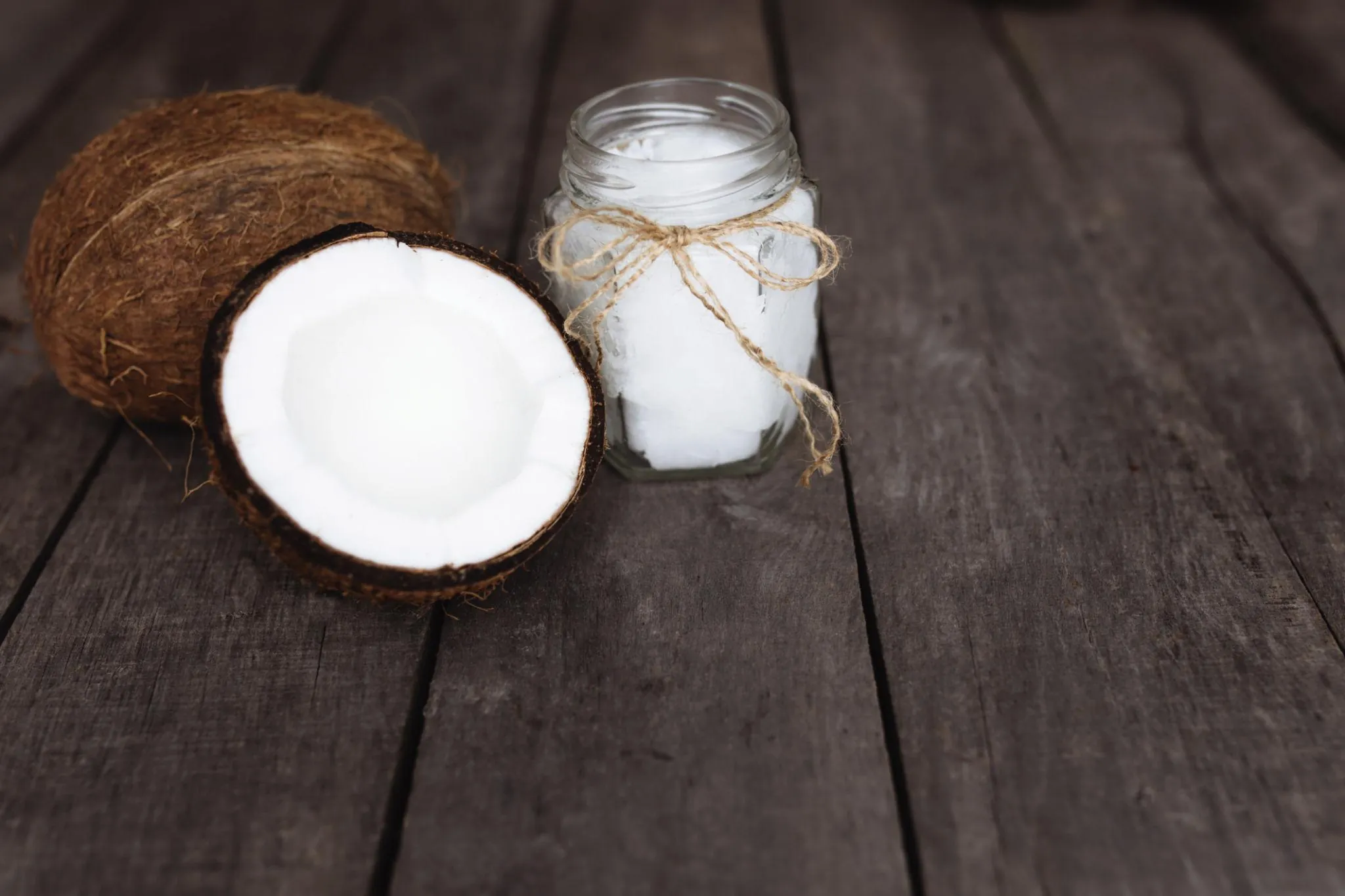 Opened fresh coconut with white meat visible